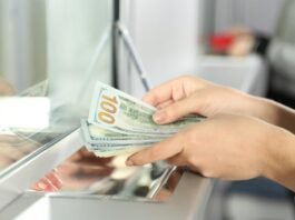 Currency exchange counter displaying foreign currency rates for customers in Pakistan