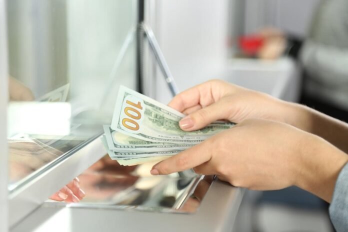 Currency exchange counter displaying foreign currency rates for customers in Pakistan